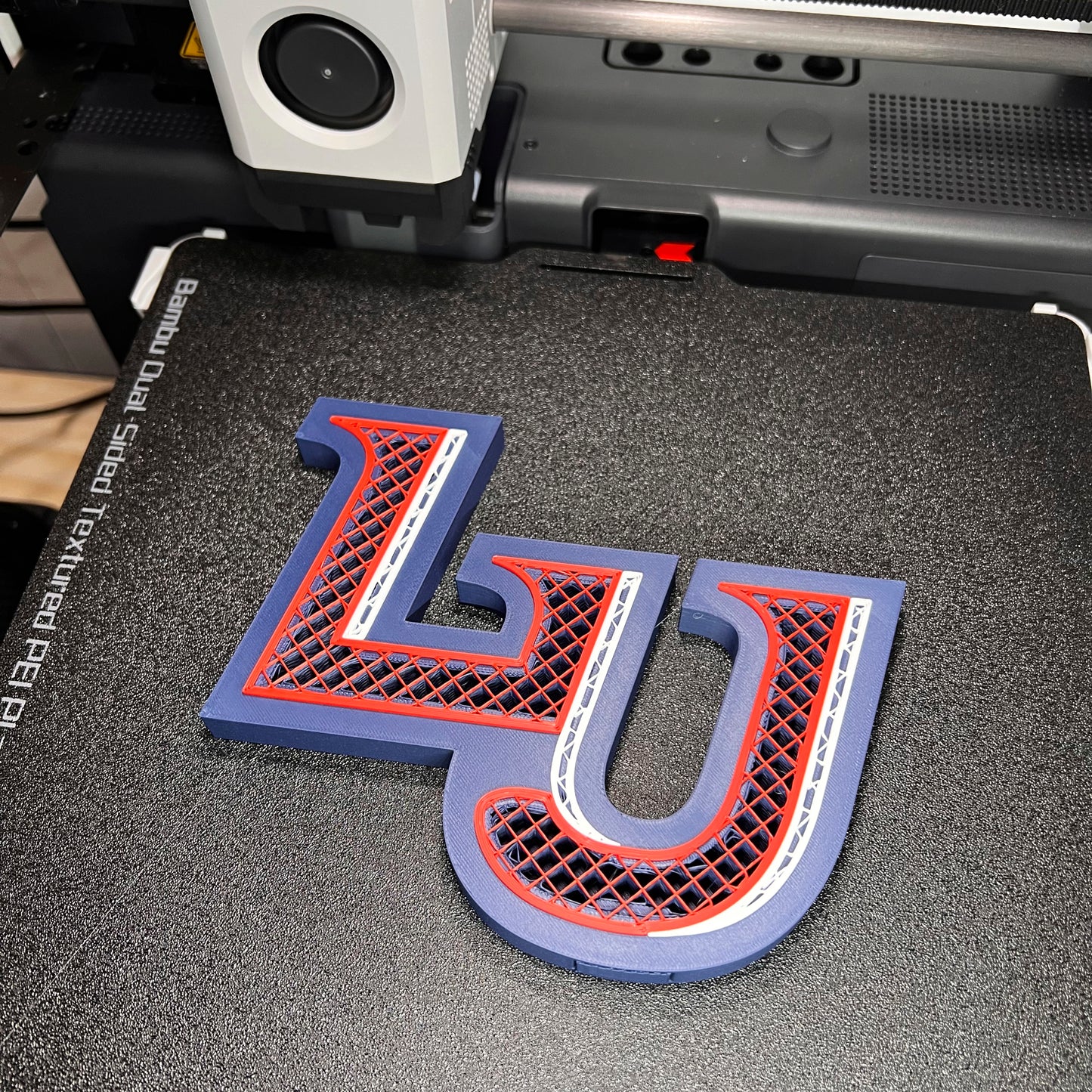 Liberty University decoration being 3D printed.