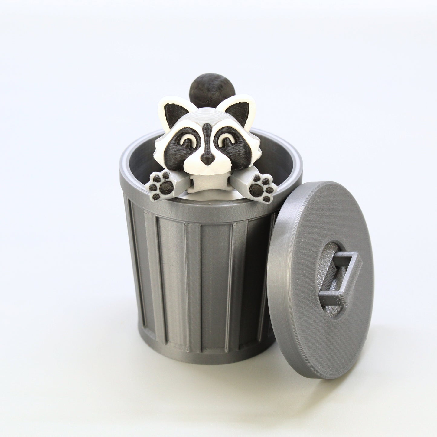 Raccoon inside of the trash can.