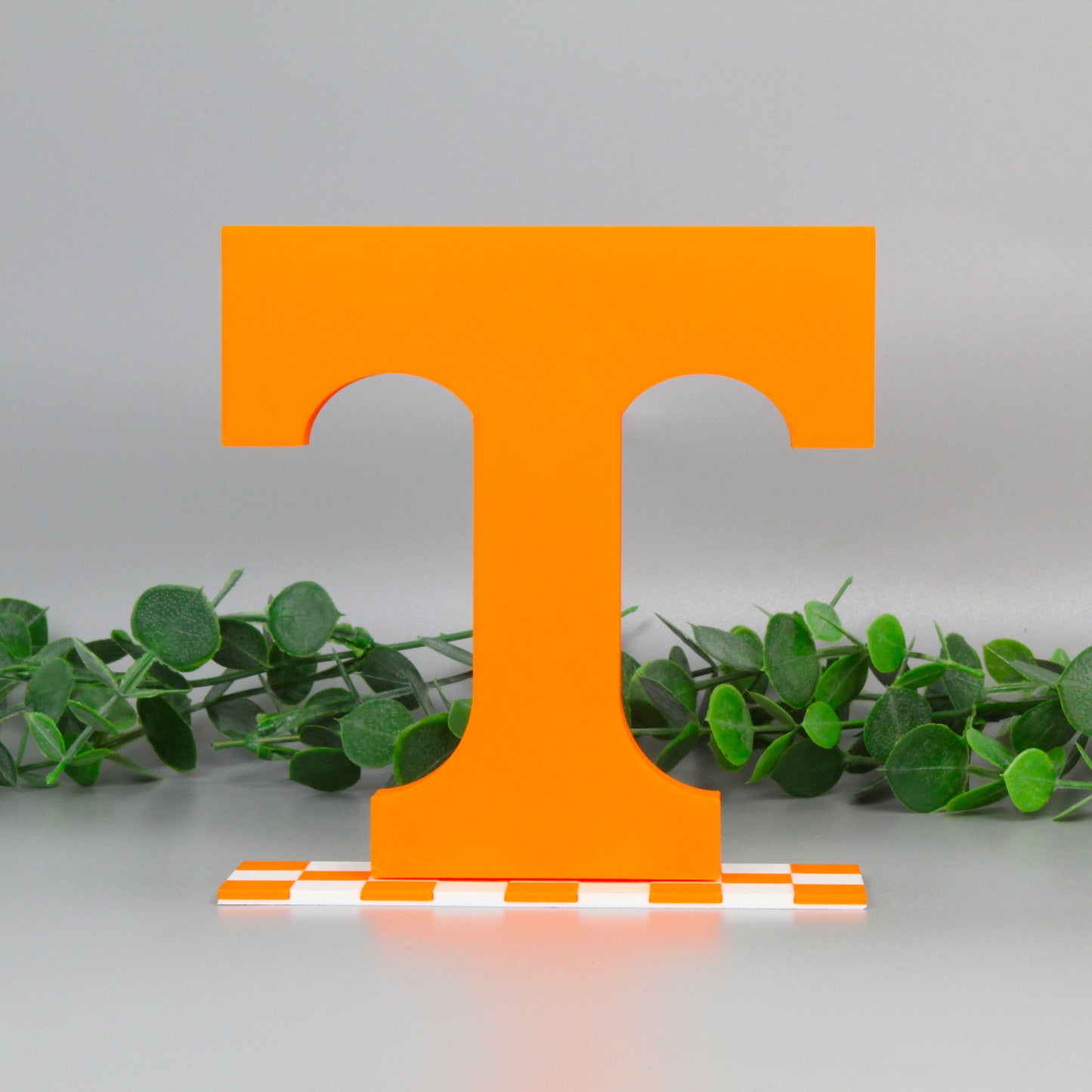 University of Tennessee decoration with ivy behind it.