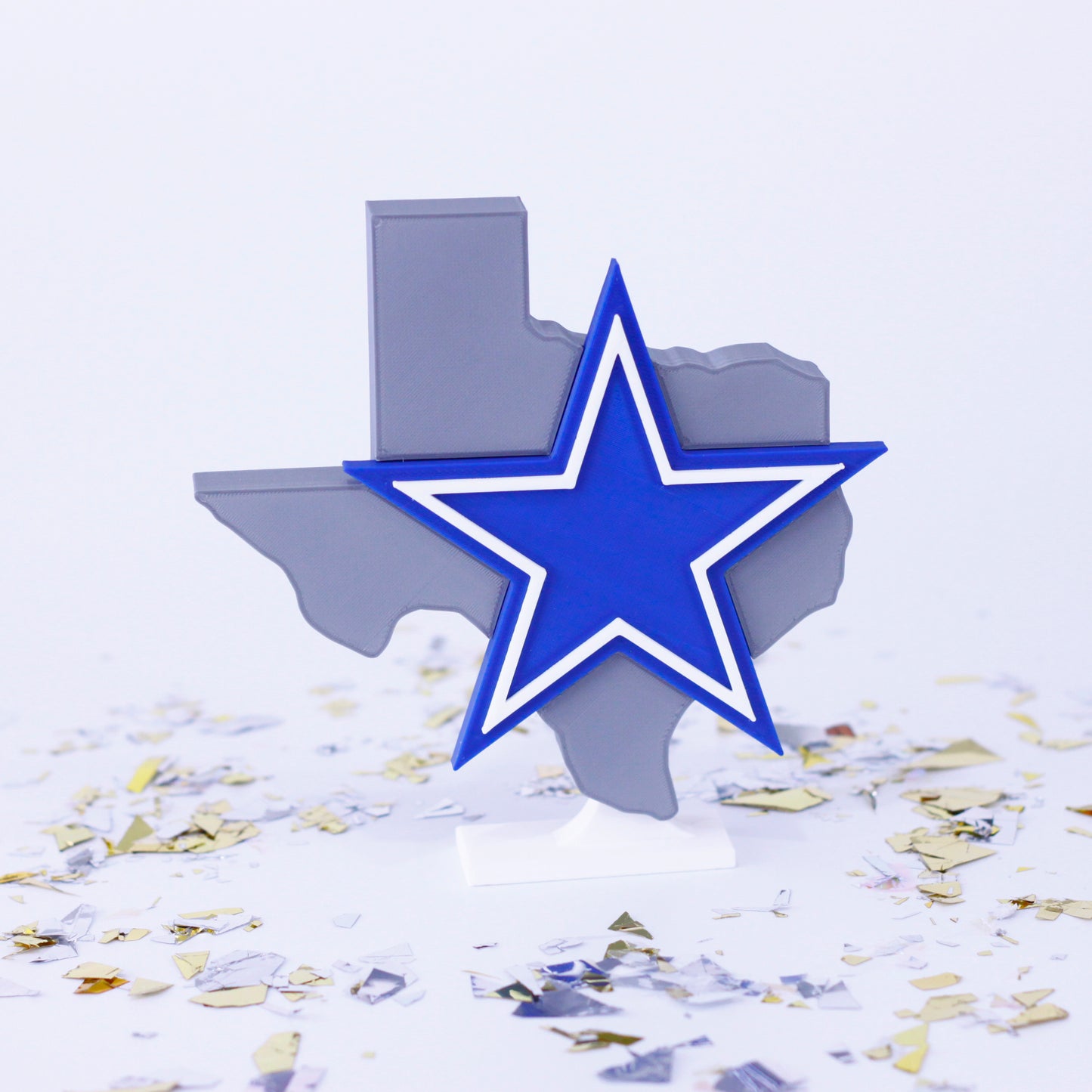 Dallas Cowboys decoration surrounded by confetti.