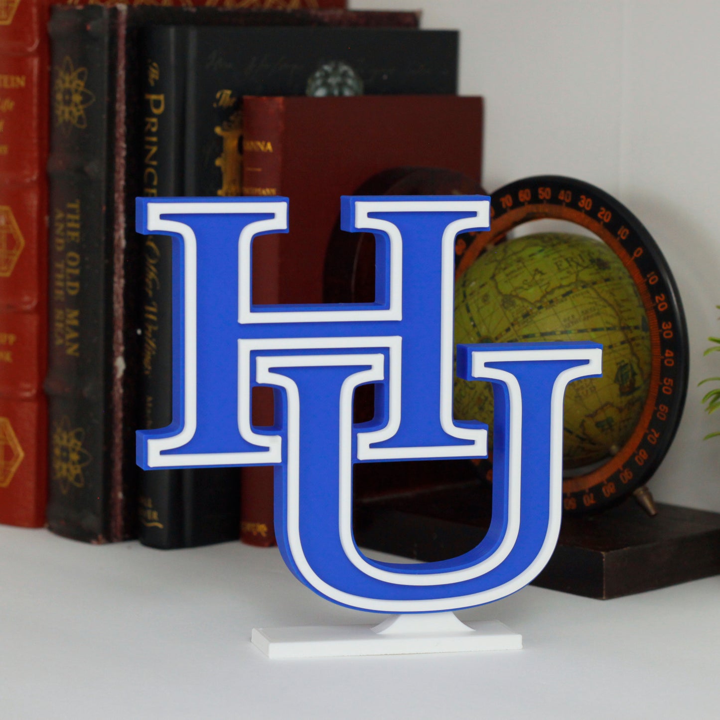 Hampton University decoration on a bookshelf.