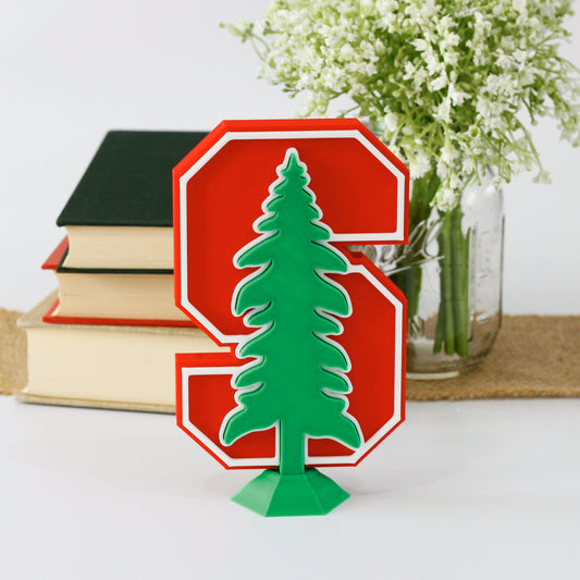 Stanford University Cardinals decoration in front of a stack of books and mason jar with baby's breath flowers.